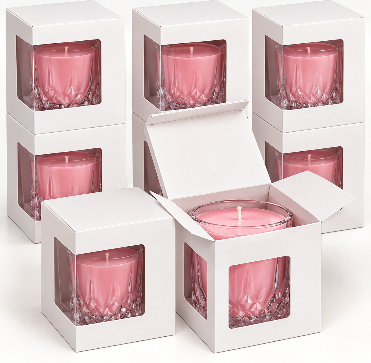 Pink tumbler candles presented in white gift boxes